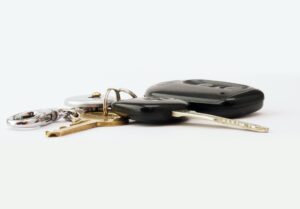 car keys on white surface